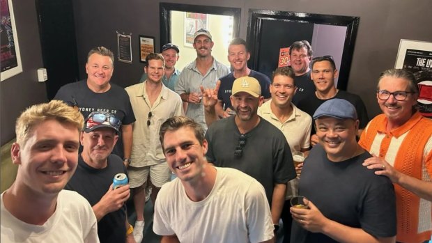 Current Australian players Pat Cummins, Steve Smith and Nathan Lyon pose with Six and Out members in Adelaide.