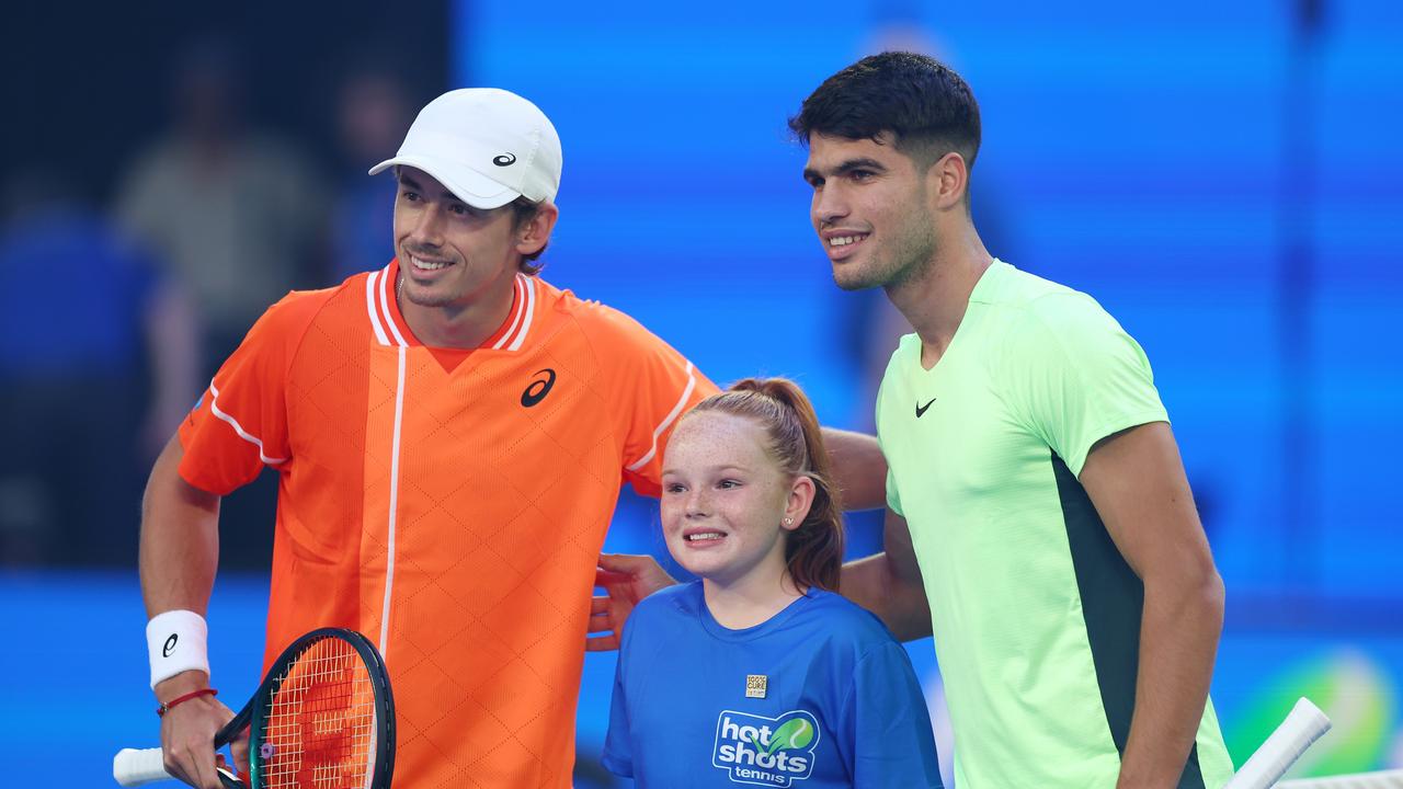 Alex de Minaur (left) and Carlos Alcaraz meet at the start of their charity match at Rod Laver Arena on Wednesday night. Picture: Graham Denholm / Getty Images