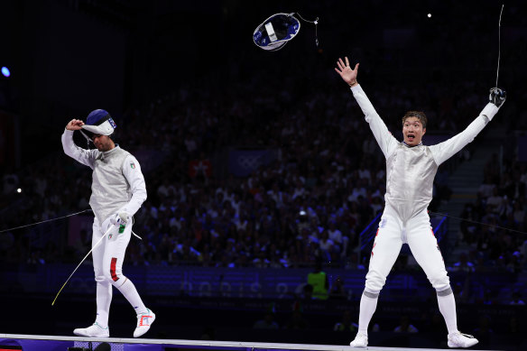 Cheung Ka-long celebrates his fencing victory over Filippo Macchi.