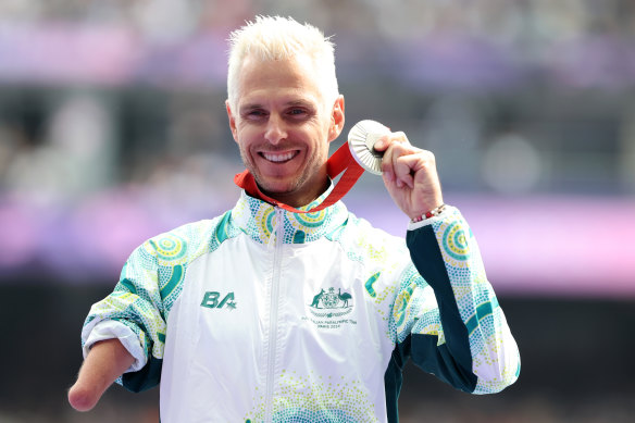Michael Roeger celebrates his silver medal.