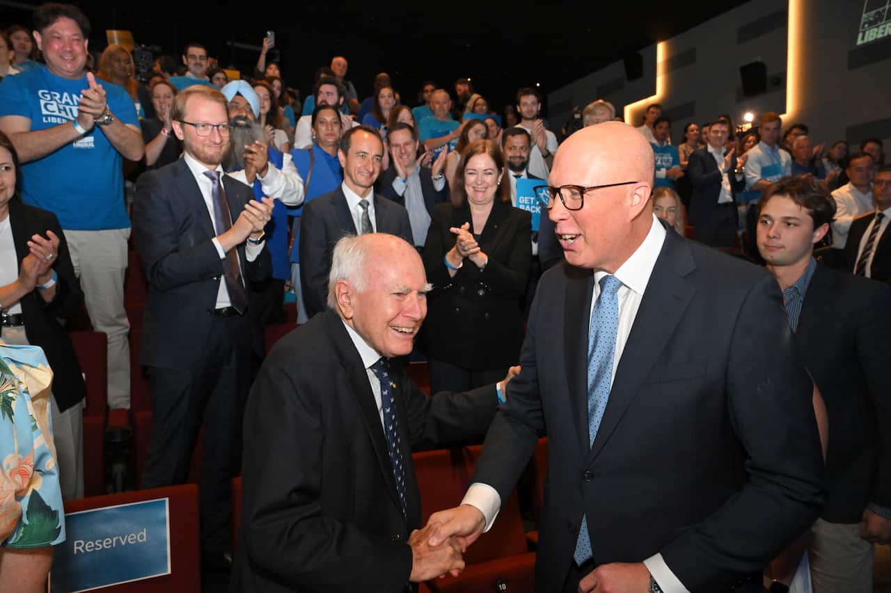 Opposition leader Peter Dutton shakes the hand of former prime minister John Howard