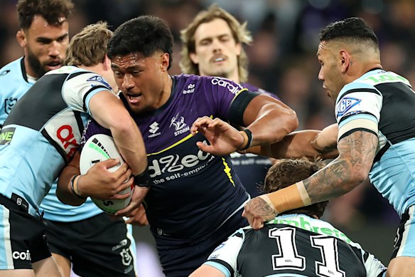 Stefano Utoikamanu charges into the Cronulla defence on Friday night.