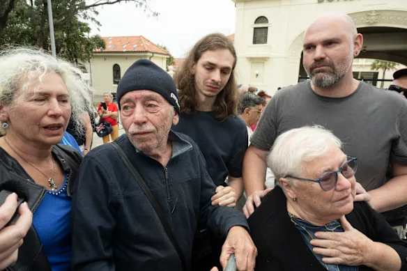 The family (aunt, grandfather, cousins and grandmother) of Matilda gather with mourners in Sydney.