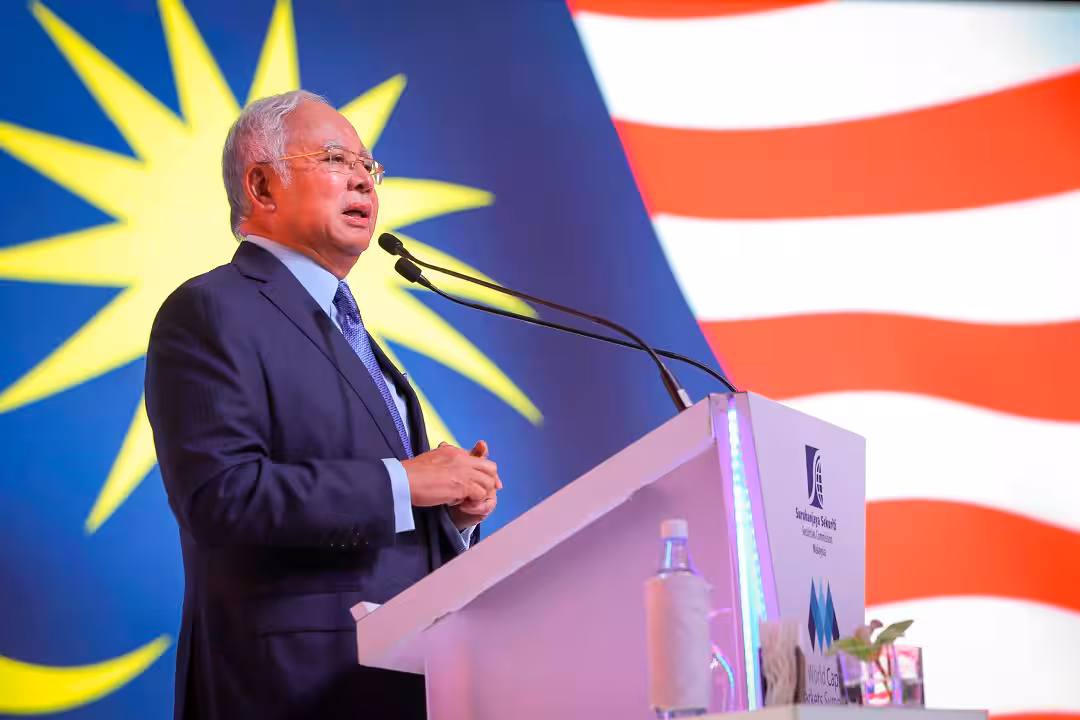Najib Razak speaking at a podium