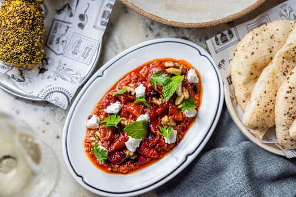 Marinated peppers with rose harissa, whipped goat’s feta and za’atar almonds.
