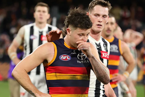 Jake Soligo with Collingwood opponent Ned Long after their qualifying final at the Adelaide Oval last year.
