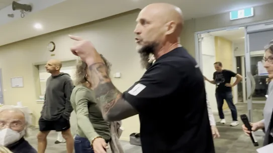 Agitator Matt Trihey disrupted a Kooyong candidates’ forum at Kew library on April 23.