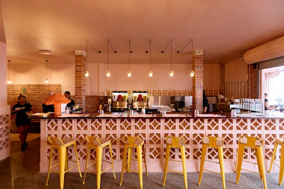 The front of the restaurant is dominated by a breeze-block-fronted bar.