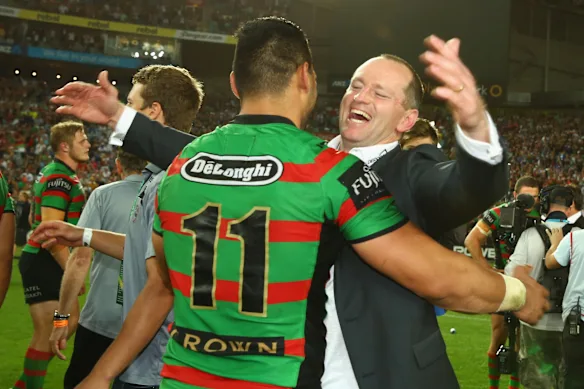 Happier times: Michael Maguire and ben Te’o celebrate after South Sydney’s premiership win in 2014.