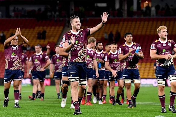 Reds second Angus Blyth celebrates with teammates after their victory over the Brumbies in 2020.