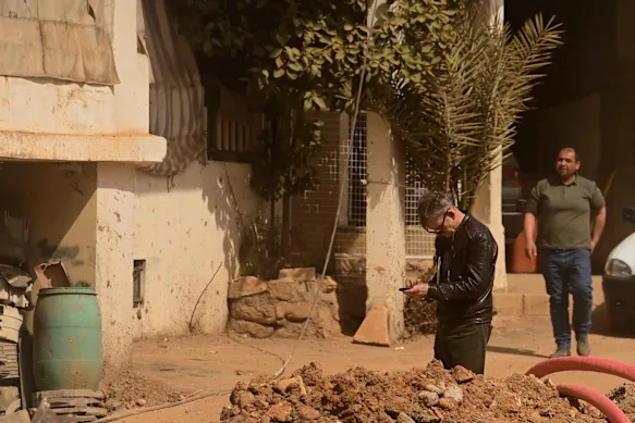 David Crowe (left) reporting in Nabi Chit, a town in the Bekka Valley, Lebanon. 
