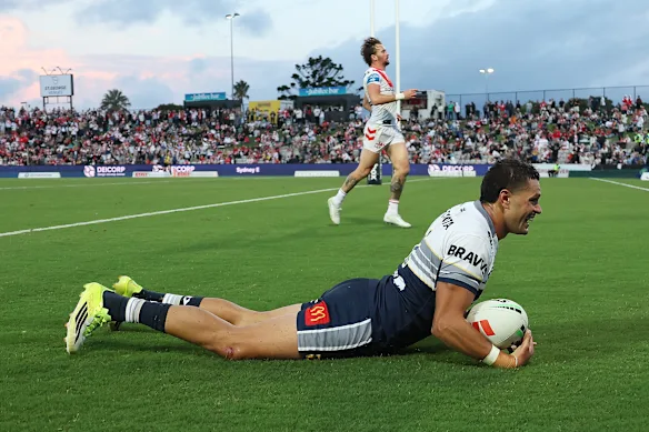Braidon Burns scores a try for the Cowboys.