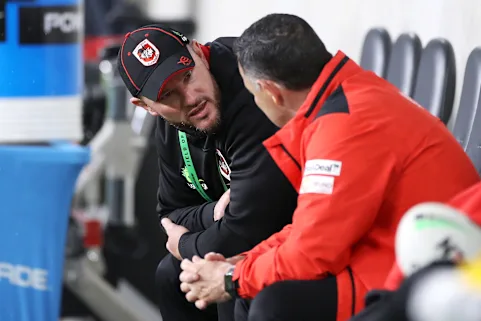 Dean Young (left) was Shane Flanagan’s assistant. He’s now replaced him.