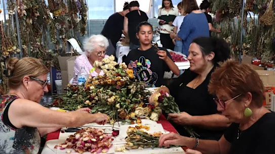 More than 100 volunteers are busy at work preserving items left at the memorial at Bondi Pavilion.