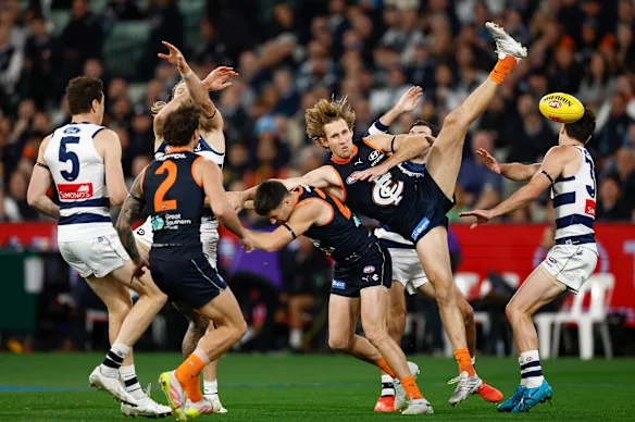 Mark Blicavs and Nick Haynes compete for the Sherrin.