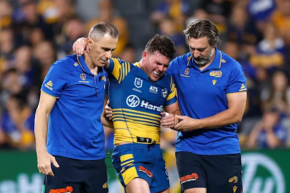 Eels hooker Ryley Smith is helped off.
