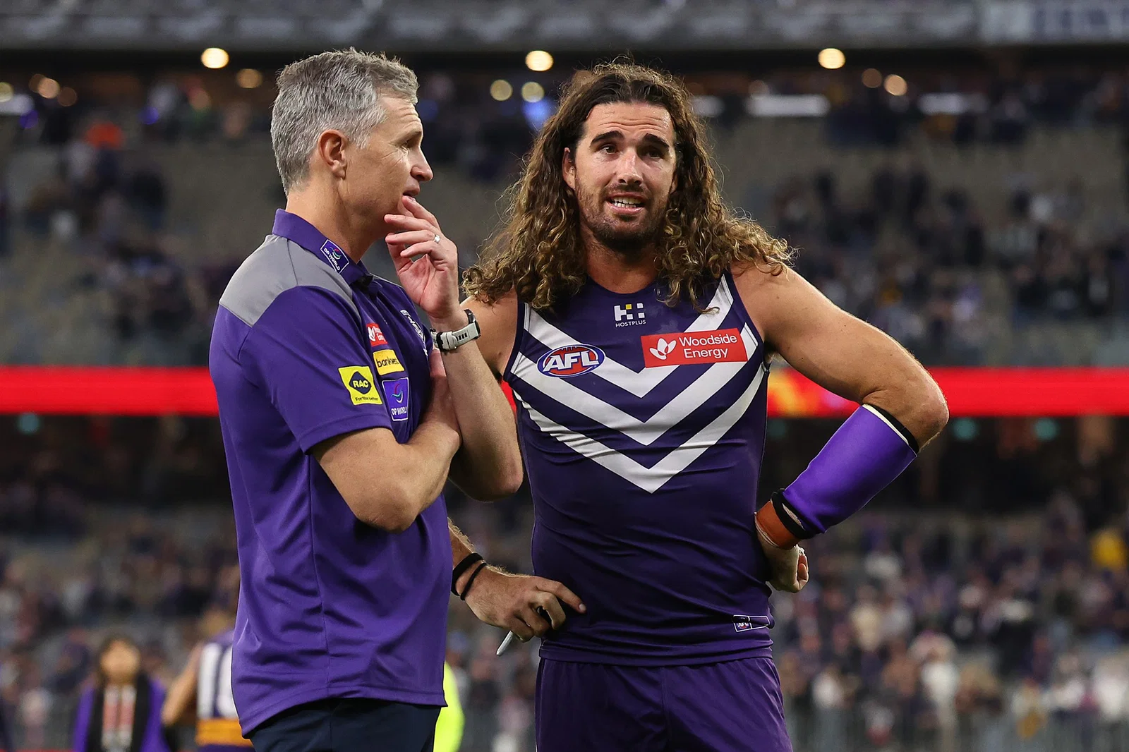 Justin Longmuir, Senior Coach of the Dockers talks with Alex Pearce after winning the round nine AFL match between Fremantle Dockers and Hawthorn Hawks at Perth Stadium, on May 07, 2026, in Perth, Australia. 