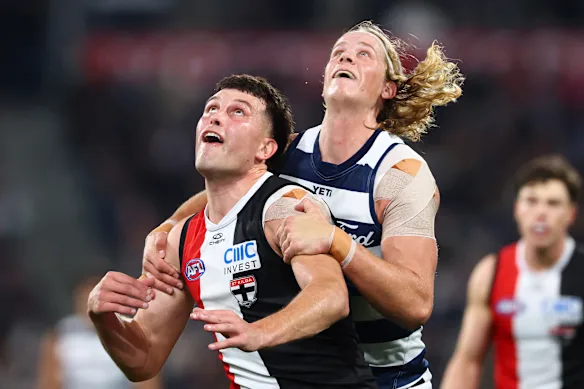 Rowan Marshall of the Saints and Sam De Koning of the Cats contest the ruck.