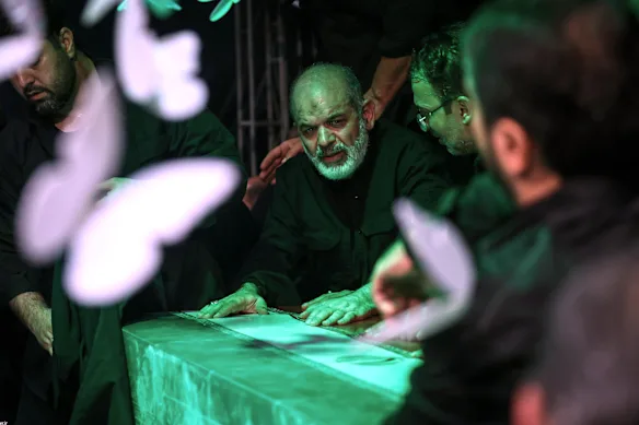 General Ahmad Vahidi sits alongside Khamenei’s casket in a mourning hall adjacent to mosque.