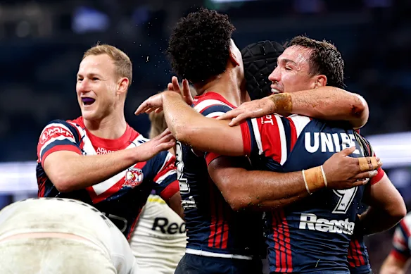 The Roosters celebrate a try against Melbourne.