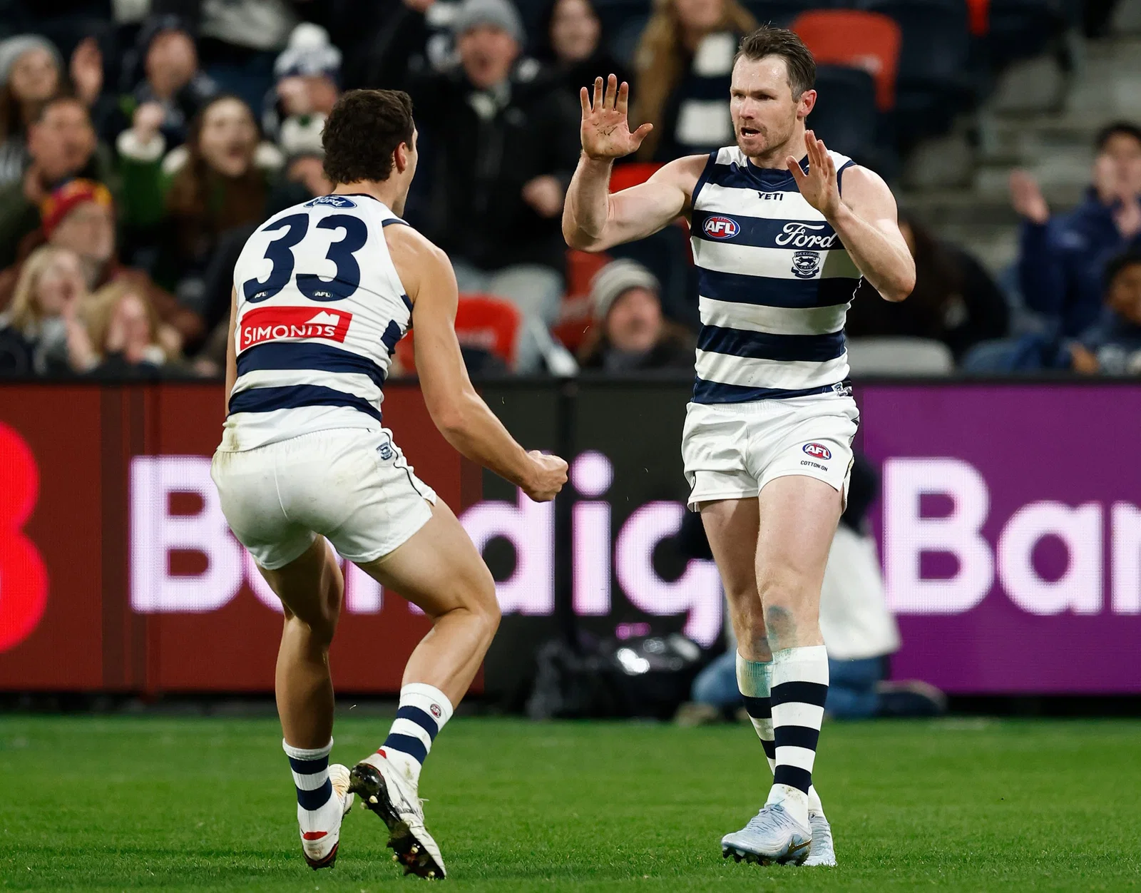 Shannon Neale (left) and Patrick Dangerfield of the Cats celebrate during the 2026 AFL Round 17 match between the Geelong Cats and the Brisbane Lions on July 2, 2026 in Geelong, Australia. 