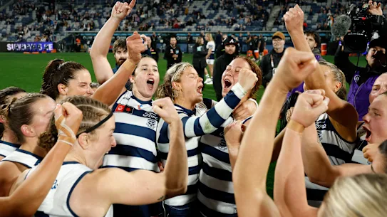 The Cats sing the team song after beating St Kilda.