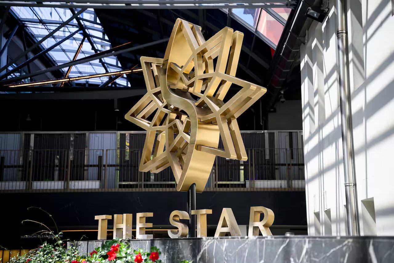 A large gold-coloured star and words 'The Star' outside the Star Casino in Pyrmont, Sydney.