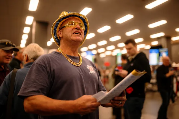 A man studies the odds at Wentworth Park on its final night of racing.